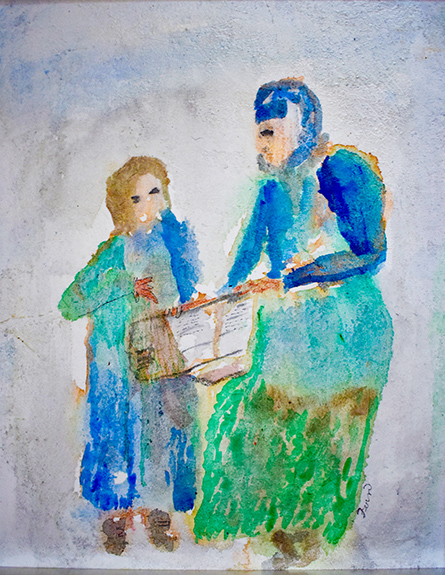 Two women reading the newspaper together.